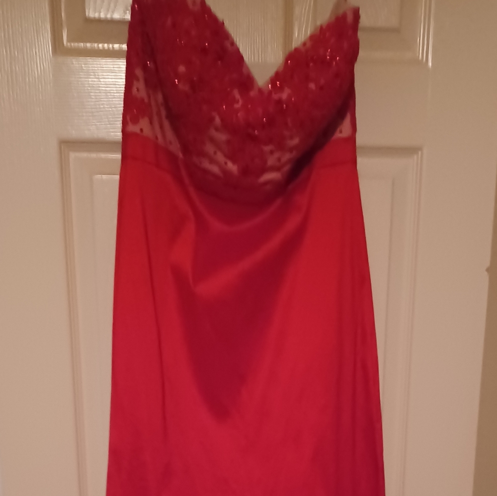 Lovely red gown that has an empire waist and floor length